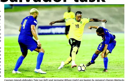  ?? FILE ?? Cayman Islands defenders Tyler Lee (left) and Jermaine Wilson (right) are beaten by Jamaica’s Darren Mattocks during their CONCACAF Nations League match at the National Stadium on Sunday, September 9, 2018. Jamaica won 4-0.