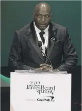  ?? TYLER PASCIAK LARIVIERE/SUN-TIMES ?? Chef Erick Williams of Chicago’s Virtue Restaurant & Bar accepts the James Beard Award for best chef Great Lakes Region on Monday night at the Lyric Opera House.