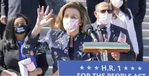  ??  ?? Speaker of the House Nancy Pelosi and the Democratic Caucus gather to promote H.R. 1, the For the People Act of 2021, a sweeping voting rights, elections and ethics bill.