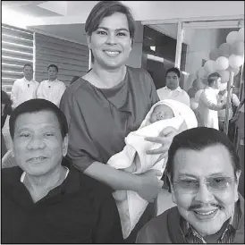  ??  ?? Davao City Mayor Sara Duterte-Carpio poses with her father, President Duterte and former president and now Manila Mayor Joseph Estrada, who stood as one of the godparents of her son, Marko Digong during the baptismal rites in Davao City yesterday....