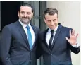  ??  ?? Emmanuel Macron welcomes Saad Hariri to the Elysée Palace in Paris