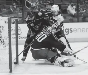  ?? ADAM CAIRNS/COLUMBUS DISPATCH ?? The puck barely trickles over the line behind Blue Jackets goaltender Elvis Merzlikins during the second period Saturday.