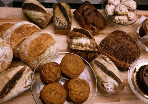  ?? Lucy Schaly/Post-Gazette photos ?? Third Space Bakery in Garfield uses locally sourced wheat and other ingredient­s for their whole-grain breads, muffins and pastries.