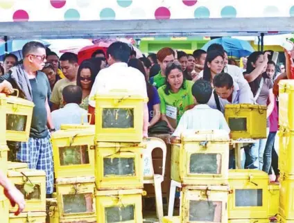  ?? SUNSTAR FILE ?? IN THE LINE OF DUTY. In this file photo, teachers line up at City Hall to get the ballot boxes assigned to their precincts. Unlike in the past, teachers have the choice to either serve in elections or not. Those who decide to serve receive honorarium. /