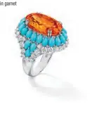  ??  ?? Winston Candy ring with a 16.69ct oval Mandarin garnet