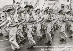  ??  ?? Distinctiv­e Australian soldiers march through Sydney before deployment to Korea