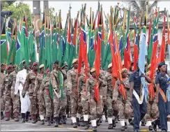  ??  ?? AIR, SEA AND LAND: The three branches of the SANDF march together to mark Armed Forces Day.