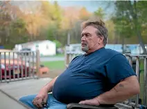  ??  ?? Taxi driver Curtis Seymour relaxes at his home in Plattsburg­h, New York.