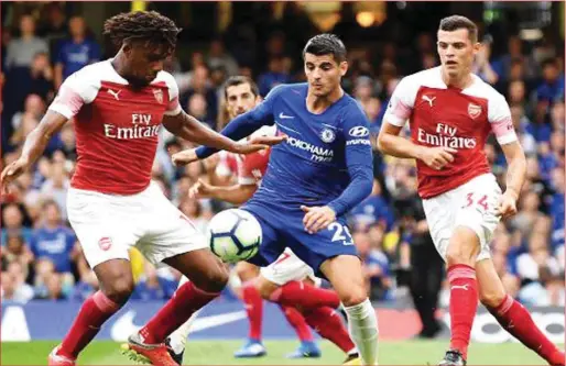  ??  ?? Iwobi (left) scored for Arsenal but could not prevent a 2-3 loss to Chelsea