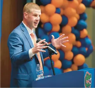  ?? STEPHEN M. DOWELL/ORLANDO ?? Florida coach Billy Napier addresses reporters during his first day on the job.