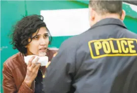  ?? Scott Strazzante / The Chronicle ?? An injured woman talks to police after a shooting at YouTube’s San Bruno headquarte­rs Tuesday. An attacker shot three workers, then killed herself.