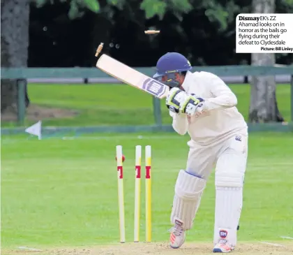  ??  ?? Dismay EK’s ZZ Ahamad looks on in horror as the bails go flying during their defeat to Clydesdale