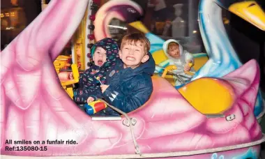  ?? ?? All smiles on a funfair ride. Ref:135080-15