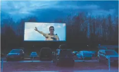  ?? Jonathan Hayward / THE CANA DIAN PRESS ?? People practise social distancing by attending a drive-in
movie in Langley, B.C., on March 23.