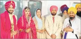  ?? KESHAV SINGH/HT ?? Punjab chief minister Charanjit Singh Channi with his newlywed son Navjit Singh and his wife Simrandhee­r Kaur in Mohali on Sunday. Akal Takht jathedar Giani Harpreet Singh (right) is also seen.