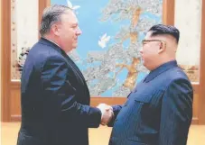  ?? Picture: AFP ?? North Korean leader Kim Jong-un (right) shakes hands with Mike Pompeo in Pyongyang last month. The US Secretary of State again met with Mr Kim yesterday.