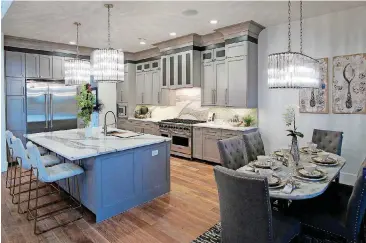  ??  ?? Kitchen and informal dining area at 14908 Cascade Drive in the Street of Dreams luxury home tour.