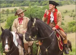  ?? The Associated Press ?? This image released by Disney shows Josh Gad as Le Fou, left, and Luke Evans as Gaston in a scene from Beauty and the Beast.The movie opens nationwide on Friday.