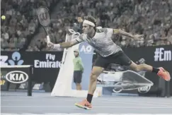 ??  ?? 0 Roger Federer rolled back the years at the Rod Laver Arena.