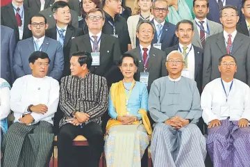  ??  ?? Suu Kyi (seated centre) and Myanmar’s president Htin Kyaw (seated second right) pose for photo after the opening ceremony of 21st Century Panglong conference in Naypyitaw, Myanmar. — Reuters photo