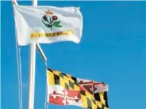  ?? KATHERINE GAHS/COURTESY PHOTO ?? The flagpole on Annapolis City Dock displays the U.S., Annapolis and Maryland flags.