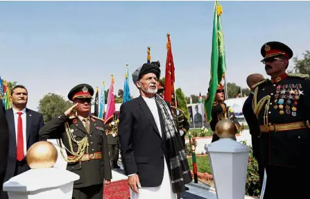  ??  ?? Important day: Ghani (centre) attending the independen­ce day celebratio­ns in Kabul, Afghanista­n. — Reuters