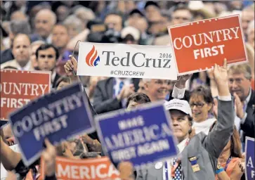  ??  ?? Dissent in the ranks: A supporter of the Texas senator pops up amid a sea of Trump boosters.