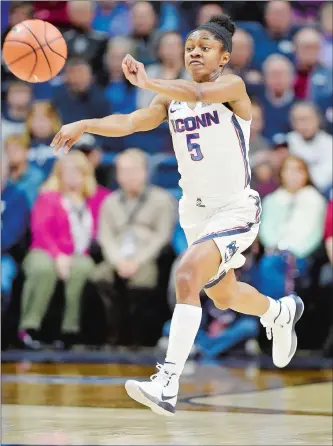  ?? SEAN D. ELLIOT/THE DAY ?? UConn’s Crystal Dangerfiel­d heaves a pass downcourt against duriing Tuesday’s game against Central Florida at Gampel Pavilion in Storrs. The No. 1 Huskies, who visit Houston this afternoon, are on pace to set a program single-season record for assists.