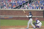  ?? ADAM HUNGER - THE ASSOCIATED PRESS ?? The Yankees’ Clint Frazier, left, watches his two-run home run against the Mets during an exhibition game July 18in New York.