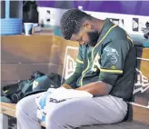  ?? Richard W. Rodriguez / TNS / Fort Worth Star-Telegram ?? A’s starting pitcher Raul Alcantara sits in the dugout after giving up five runs, including a grand slam, to the Texas Rangers in the second inning at Globe Life Park in Arlington, Texas.