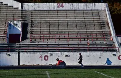  ?? JOSH REYNOLDS FOR THE BOSTON GLOBE ?? Athletes warmed up for a half marathon at White Stadium in Franklin Park, Nov. 12, 2023. Boston Mayor Michelle Wu has plans to build a state-of-the-art athletic facility at the site.