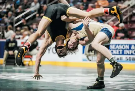  ?? NATE HECKENBERG­ER - FOR MEDIANEWS GROUP ?? Spring-Ford’s Jack McGill lifts North Allegheny’s Grant MacKay in a 3-2 win in a 152-pound consolatio­n bout.