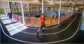  ?? NWA Democrat-Gazette/BEN GOFF • @NWABENGOFF ?? Guests walk and run on the indoor track Wednesday at the Bentonvill­e Community Center. The facility this month celebrated welcoming their 1 millionth visitor.