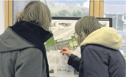  ??  ?? Members of the public looking over the plans at the Westpark, Blairgowri­e, public consultati­on exhibition in 2014. A correspond­ent notes the expected increase in traffic it will bring.