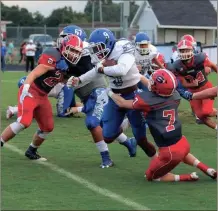  ?? LARRY GREESON / For the Calhoun Times ?? Sonoravill­e’s Blade Bryant (7) and Colton Richards (26) look to bring down Cass’ Thomas Gilliam during the first quarter.