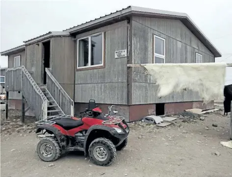 ?? THE CANADIAN PRESS FILES ?? A polar bear hide hangs drying outside of a house in the town of Gjoa Haven. The federal government will make a long- term funding commitment to Indigenous housing in next week’s budget worth hundreds of millions of dollars, The Canadian Press has...