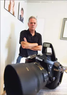  ?? Christian Abraham / Hearst Connecticu­t Media ?? Passport Pro owner Kurt Olson stands inside his store at 850 Canal St., next to the Connecticu­t Passport Agency, in Stamford on Sept. 22.