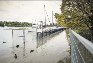  ?? BOB TYMCZYSZYN/ST. CATHARINES STANDARD/POSTMEDIA NETWORK ?? High water levels in Lake Ontario are reflected in Port Dalhousie, Ont. The lake’s outflows are at “maximum values” and there’s no decrease in sight.