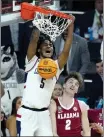  ?? ?? UConn guard Stephon Castle dunks over Alabama forward Grant Nelson during the late Final Four game in Glendale, Ariz.