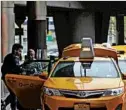 ?? KATHY WILLENS/AP ?? MIT researcher­s say 98 percent of New York’s taxi cab demand could be met with 3,000 cars and software.