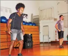  ?? MICHILEA PATTERSON — DIGITAL FIRST MEDIA ?? Musician David Charles, left, and Aaron Christ perform during a fitness concert at West Pottsgrove Elementary School. The performanc­e combines fitness and music.