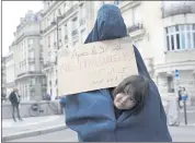  ?? ADRIENNE SURPRENANT — THE ASSOCIATED PRESS ?? A womAn weAring A BurqA And holding A poster reAding “Do not forget us After Aug. 31” Attends A gAthering SAturdAy.