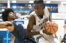  ?? CAPITAL GAZETTE
PAUL W.. GILLESPIE/ ?? South River’s Trashaun Timmons, left, and Meade’s Shawn Jones in another game. The Seahawks defeated Meade 63-54 on Friday.