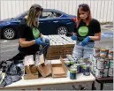  ?? CONTRIBUTE­D BY ACTION MINISTRIES ?? Laura Sterling and Kaitlyn Reeves help launch Action Ministries’ initiative Smart Lunch, Smart Kid, which in June served over 300 kids.