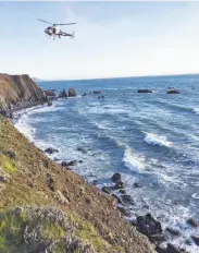  ?? California Highway Patrol / Associated Press ?? A vehicle, visible at lower right, plunged off Highway 1 near Mendocino on Monday, killing five.