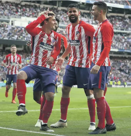  ?? Getty ?? Atletico Madrid have held on to Antoine Griezmann, centre, a transfer target of many clubs