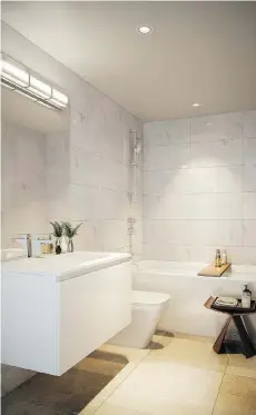  ??  ?? Bathrooms at Main and Twentieth will come with polished quartz counters and Aster Cucine cabinets, porcelain floor tiles and shower wall tiles.