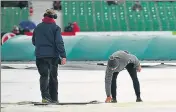  ?? REUTERS ?? Ground staff look at the wicket at Malahide where Ireland make their Test debut against Pakistan.