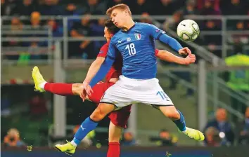  ?? AP ?? Portugal’s Mario Rui (red) and Italy’s Nicolo Barella jump for the ball during the Uefa Nations League match at San Siro Stadium in Milan on Saturday.