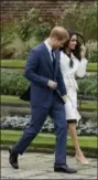  ?? MATT DUNHAM — THE ASSOCIATED PRESS FILE ?? Britain’s Prince Harry and his fiancee Meghan Markle pose for photograph­ers during a photocall in the grounds of Kensington Palace. Fans of the British royals will want to include castles, Westminste­r Cathedral and other sites connected to Queen...